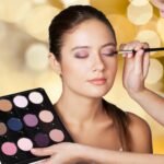 Professional makeup artist doing makeup girl