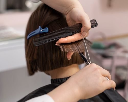 woman-getting-treatment-hairdresser-shop_23-2149229816